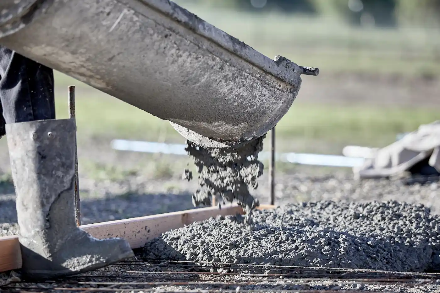 Close up of concrete being poured .